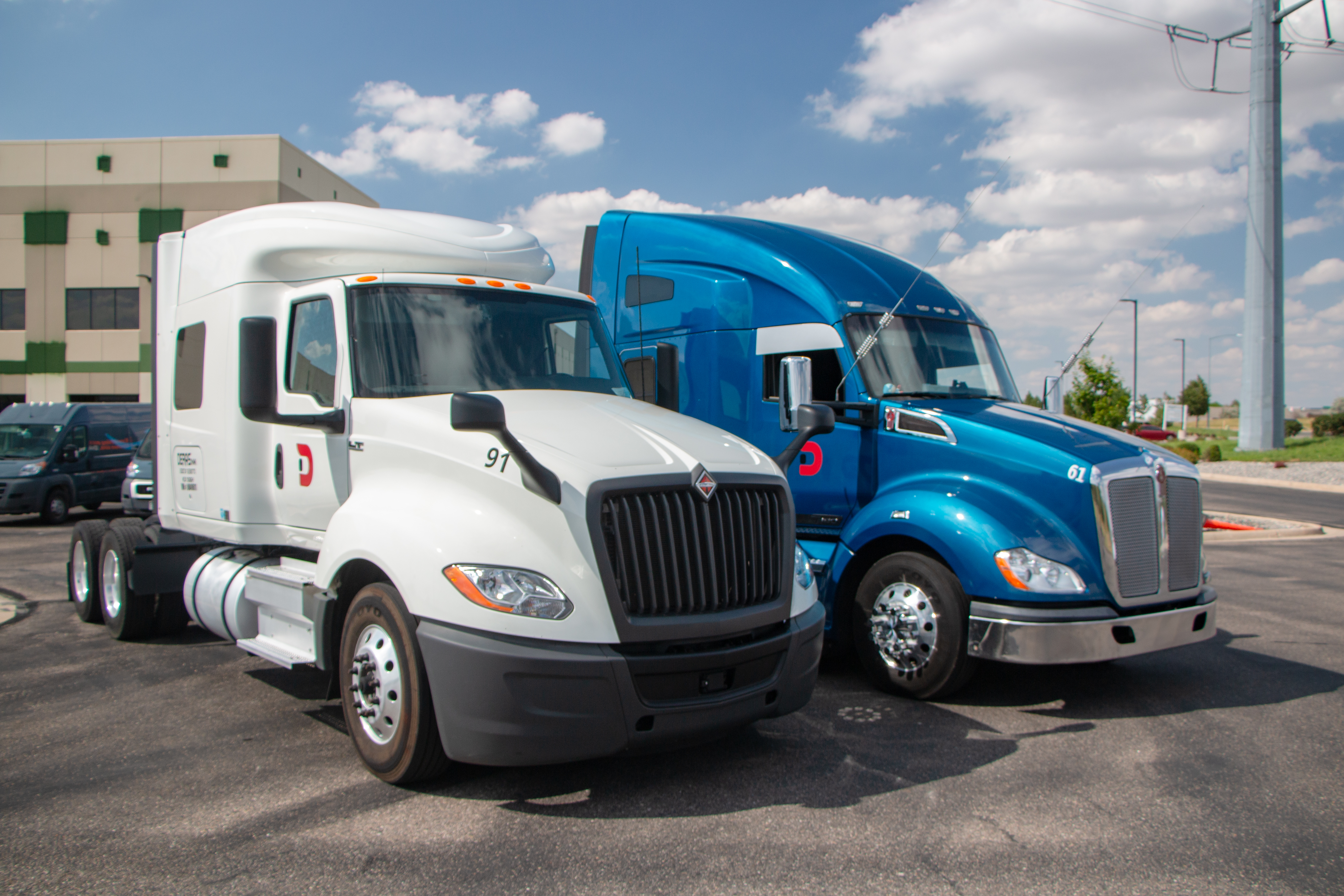 Deras Trucking semi-truck with a white trailer